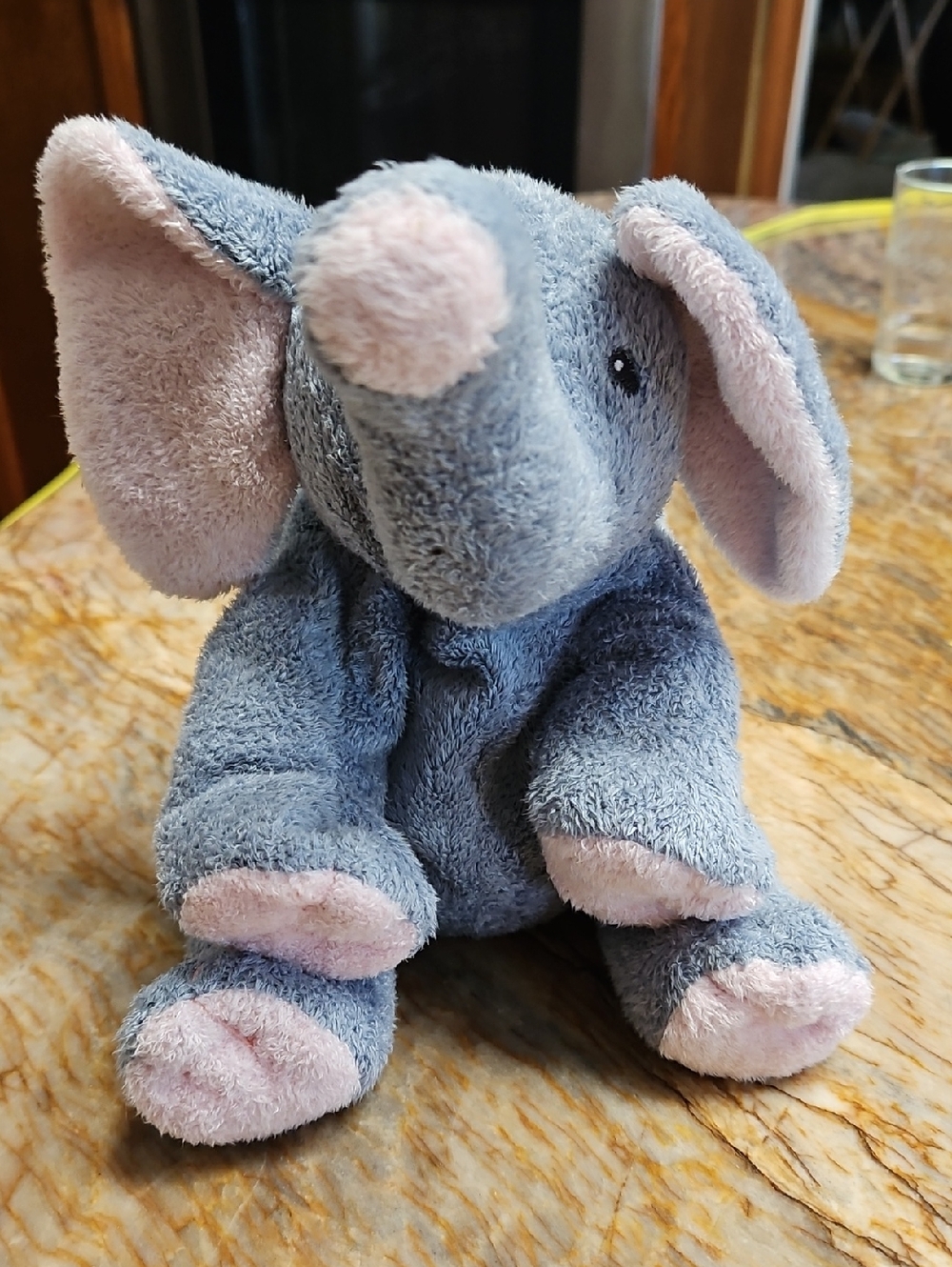 TY Pluffies Winks the Elephant plush toy with pink and gray coloring.